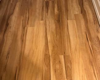 Picture of installed vinyl plank wood flooring that is available. 300 ft.² approximately in boxes.