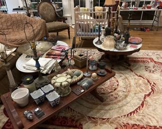 Numerous tables of different styles and Home interior collector items