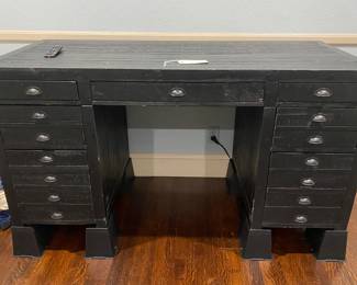 Black painted wood desk with metal hardware 
L 62 1/8” x D 28” x H 31”