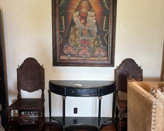 2/18 century Portuguese carved walnut chair with embossed leather.
Black metal rounded sideboard.
Large religious painting on canvas Unsigned
43 3/4” x 65 3/4”
