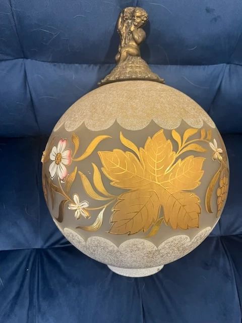 Vintage Made in Belgium Lamp Globe Only.  This is the GLOBE only to a once gas table lamp that had been converted to electric.  The table/stand was broken.  The intricate detail on the Globe is beautiful.  The lamp was originally purchased at an estate sale in 1982 and the relative of the owner said in was from the early 1900s.  Height 17" with angel.  Circumference is approx. 37-1/2"  Bottom is approx. 3-1/2".  