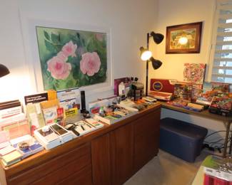 Office area, games, jigsaw puzzles, office supplies, iPad, storage bins, binoculars.