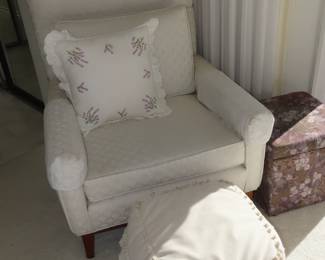 White armchair and poof.