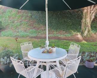 White mesh and metal patio table/chairs and umbrella set.