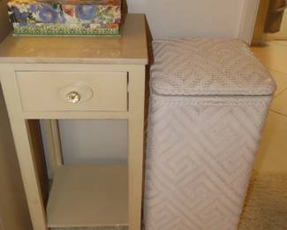 Wicker laundry hamper, narrow nightstand.