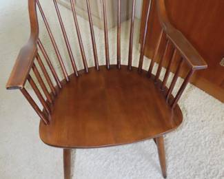One of four stickback Windsor style dining chairs.