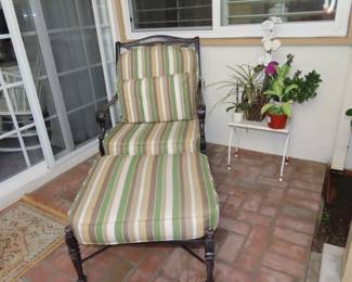 Heavy patio chair and footstool.