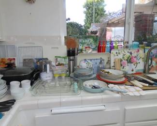 Pyrex, utensils, trays, colored glass bottles, ramekins, food processor, electric skillet.