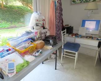 Sewing machine, sewing and crafting/scrap book supplies, computer deask and chair.