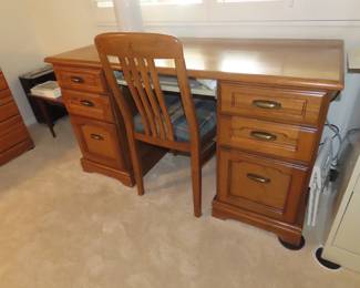 Knee hole writing desk and chair.