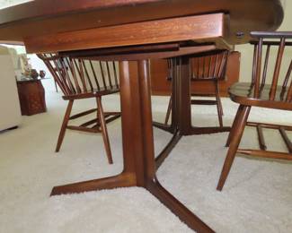 Made in Denmark, "Gudme Mobelfabrik", teak dining table with two leaves stored underneath.