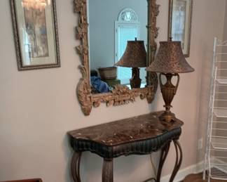 Marble top table and ornnate mirror