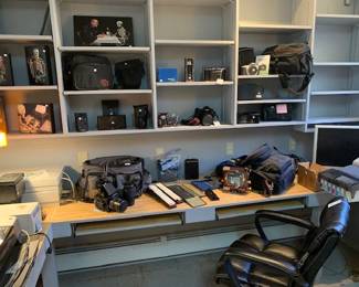 Lots of cameras, camera equipment, and photo printers