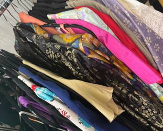 SEVERAL racks of designer ladies clothing