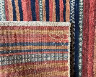 Red striped handwoven Kilim Rug signature waved into design, 106“ x 66” cut pile
$1000 Aprox 20 lbs