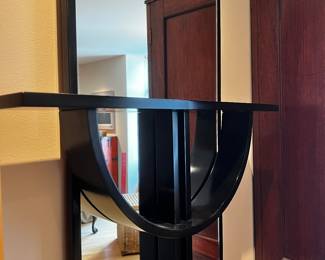 Wall Mirror with Sculptural Black  Shelf in a style of cross
66”h x 27”w x 5.5” deep overall dimensions 
$800
