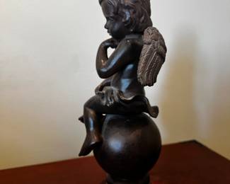 Pottery composite (resin?)sculpture of Cupid Cherub
12”h x 7”w x 5”d
$40