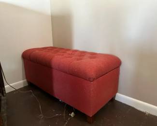 red cushioned ottoman