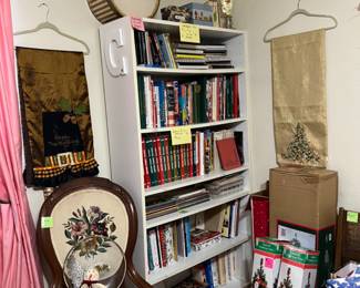 Cookbooks, chairs, art, book shelf