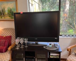 TV, movies, Gator etc sports items, goblets, pair of chairs