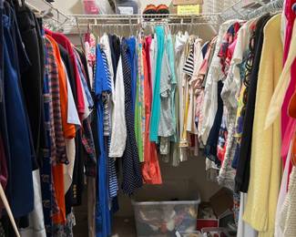 Some of the hundreds of pieces of clothing and shoes & purses