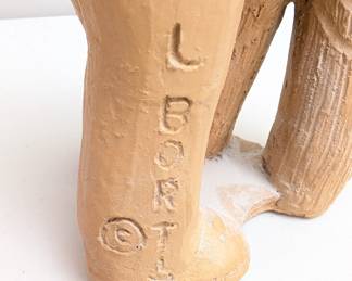 Closeup of Lee Bortin Original clay sculpture, two boys whispering