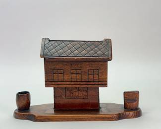 1922 hand carved American Folk Art mechanical cigarette dispenser with a match box holder and a cup for spent matches, made by Chaim Chandowsky while a prisoner of war in Białystok, Poland