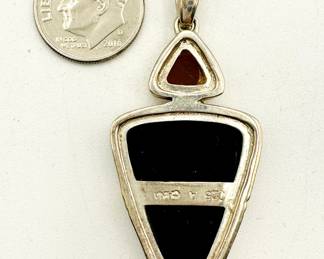 Reverse view of a Chinese sterling silver pendant