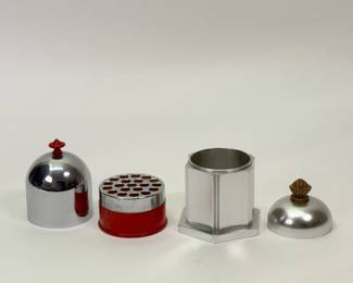 Another view of Art Deco cigarette holders — Scovill chrome and red painted dome shape, and a Lurelle Guild For Alcoa Kensington Ware aluminum cigarette box