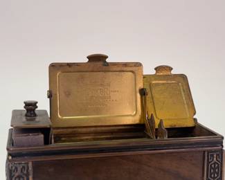 Closeup of vintage Arts and Crafts era smoking station, made by Doerr Manufacturing Company in Grand Rapids Michigan. Storage for cigarettes, matches, etc.