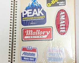 Collection of vintage stickers, mainly automotive and beer brands