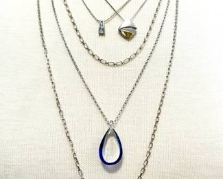 Variety of necklaces, marked sterling silver, one with glass pendant