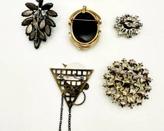 Reverse view of fantastic vintage brooches and pins
