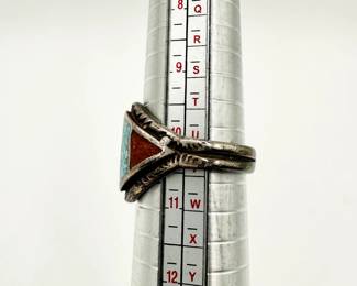 Side view of vintage Native American southwest design silver ring with inlaid turquoise and carnelian