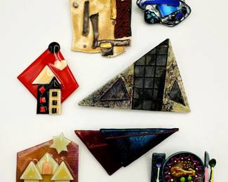 Costume jewelry pins and brooches of many styles