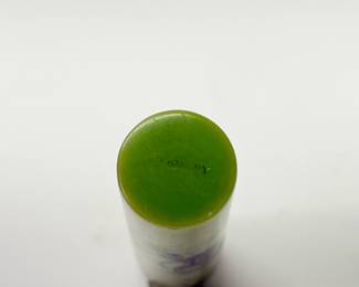 Closeup of Art Deco era manicure set containers and covered perfume container, made in France and Germany