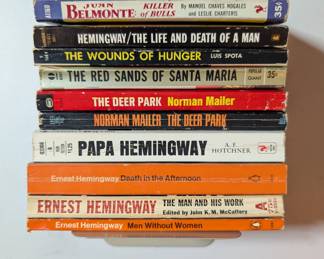 Paperback books by Normal Mailer, by and about Ernest Hemingway, et al