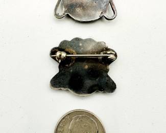 Reverse view of pair of vintage Zuni Pueblo native American chieftain design inlaid silver pins