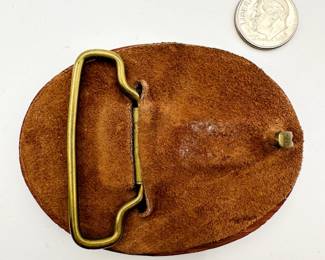 Reverse view of hand carved Native American inlaid wood belt buckle