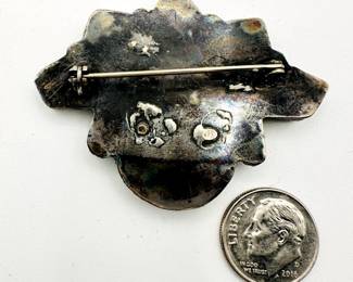Reverse view of vintage Native American southwestern jewelry - beautiful inlaid pin