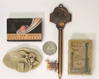 Chicago World's Fair Souvenir Playing Cards in original box, a Chicago World's Fair 1933 Key, a 1934 Chicago A Century of Progress pin, and a Century of Progress package of playing cards