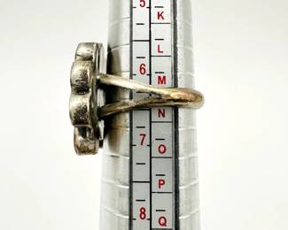 Side view of vintage inlaid native American Zuni Pueblo silver ring inlaid with mother of pearl, onyx, turquoise and carnelian in a chieftain design