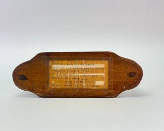 Base of 1922 hand carved American Folk Art mechanical cigarette dispenser with a match box holder and a cup for spent matches, made by Chaim Chandowsky while a prisoner of war in Białystok, Poland