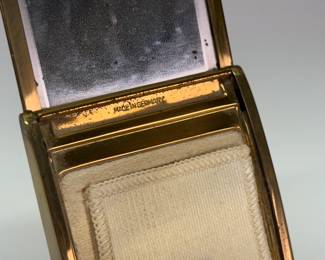 Closeup of German Art Deco mirrored powder and lipstick compacts
