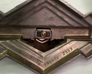 Closeup of base of cast metal Art Deco era picture frame