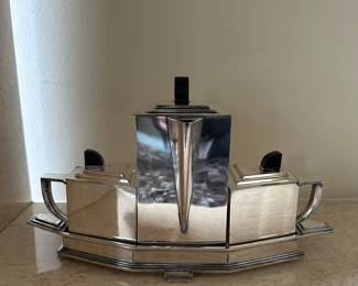 "Diament" Tea Set, circa 1928, designed by Jean G. Theobald. Made of silver plate and Bakelite by Wilcox Silver Plate Co. in America. With its stunning Art Deco lines, examples of this tea set can be seen in the Los Angeles County Museum of Art and the Museum of Fine Art Houston.