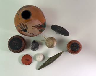 Another view of Native American southwest pottery pieces by artists including Myron Charlie, Hilda Whitegoat, M. C. Antonio and more