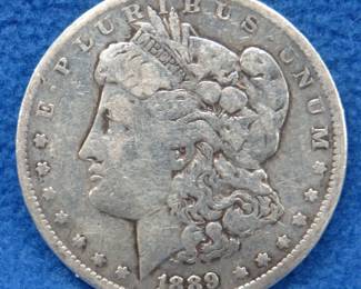 Lot 15. 1889 O Morgan silver dollar
