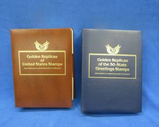 Lot 106. 22kt gold-plated replicas of US Stamps with First Day of Issue cachets. Approx. 128 stamps in two binders.