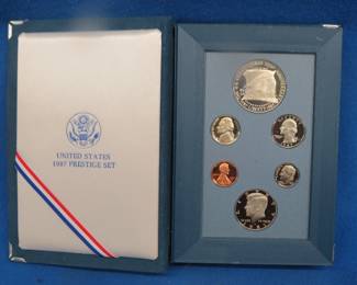 Lot 33. U.S. 1987 Liberty Prestige Set including a 90% Silver Dollar
